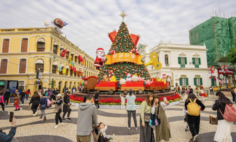 Tourists visit the Senado Square in south China's Macao, Dec. 12, 2024.

The historic center of Macao, a UNESCO world heritage site, bears witness to one of the earliest and longest-lasting encounters between China and the West.

The narrow and elongated area is dotted with historic buildings, from the A-Ma Temple dedicated to the sea-goddess Mazu, to the Mandarin's House -- the former residence of a prominent Chinese historical figure, and the landmark Ruins of St. Paul's, once among the largest Catholic churches in the Far East. (Xinhua/Zhu Wei)