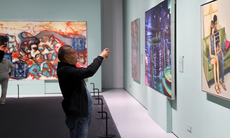 People visit the Guangdong Museum of Art in Guangzhou, south China's Guangdong Province, Dec. 6, 2024.

The Bai'etan Greater Bay Area Art Center in the southern Chinese metropolis of Guangzhou opened to the public on May 1, adding a new cultural landmark to the Guangdong-Hong Kong-Macao Greater Bay Area.

The art center, integrating the Guangdong Museum of Art, the Guangdong Intangible Cultural Heritage Museum and the Guangdong Literature Museum, has a total construction area of approximately 145,000 square meters, including an exhibition area of over 40,000 square meters and a shared public area of 35,000 square meters. (Xinhua/Lu Hanxin)