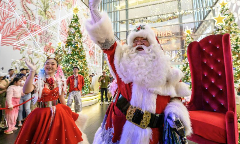 A man dressed as Santa Claus is seen on a street in Kuala Lumpur, Malaysia, Dec. 22, 2024. (Photo by Chong Voon Chung/Xinhua)