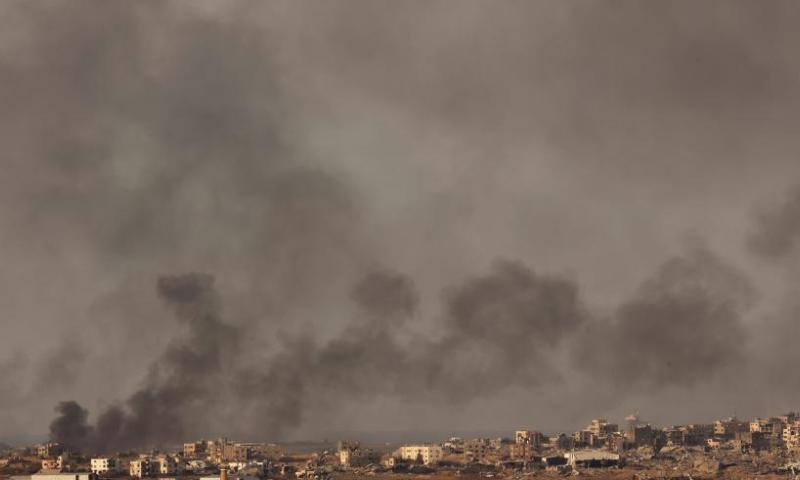 Smoke billows following Israeli strikes in the Gaza Strip, as seen from Israel's southern border with the Gaza Strip, on Dec. 22, 2024. (Photo by Gil Cohen M/Xinhua)