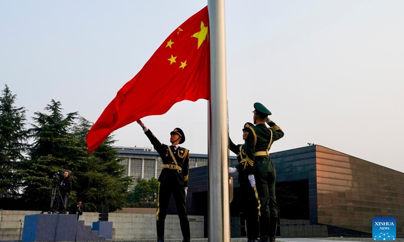 A flag-raising ceremony is held at the Memorial Hall of the Victims in Nanjing Massacre by Japanese Invaders in Nanjing, capital of east China's Jiangsu Province, Dec. 13, 2024. Friday marks the 11th national memorial ceremony for the Nanjing Massacre victims. (Xinhua/Li Bo)