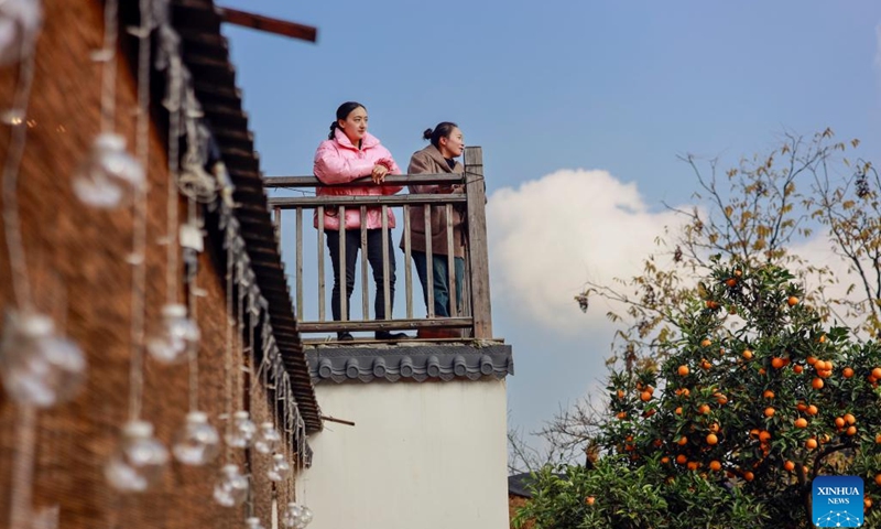 Tourists are seen at a homestay in Tianfu Town of Beibei District, southwest China's Chongqing Municipality, Dec. 11, 2024. In recent years, the town of Tianfu, with unique natural scenery as well as abundant resources for cultural tourism in its countryside, has promoted the improvement of village environment and the upgrading of infrastructure. The town has transformed vacant rural houses into a group of high-quality homestays, which not only accommodate tourists with an immersive rural experience, but also bring lucrative job opportunities to local villagers. (Xinhua/Liu Chan)