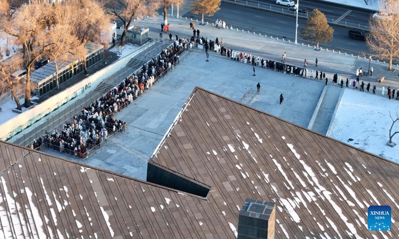 An aerial drone photo taken on Dec. 12, 2024 shows people lining up to enter the Exhibition Hall of Evidences of Crime Committed by Unit 731 of the Japanese Imperial Army in Harbin, northeast China's Heilongjiang Province. The former site of the notorious Japanese germ warfare army, known as Unit 731, reopened to public on Friday with a special exhibition on cultural relics and historical materials of Japan's germ-warfare crimes in China. (Xinhua/Wang Song)