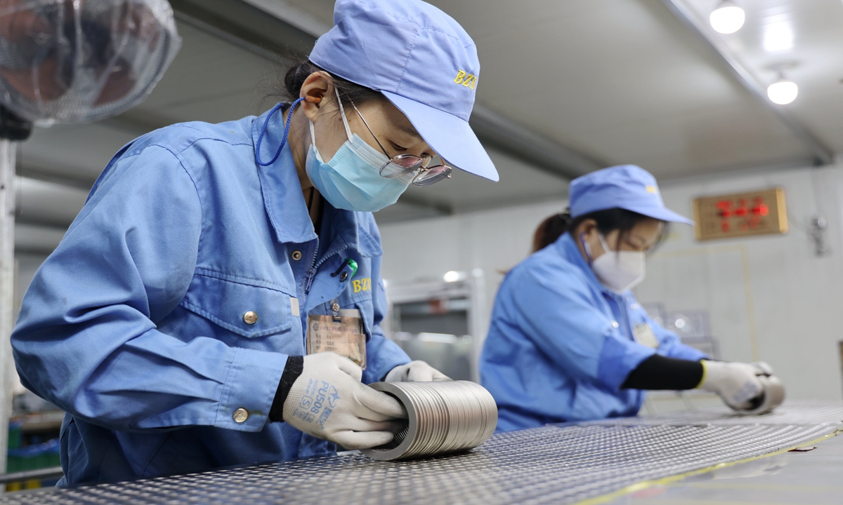 Workers at an engine component factory in Binzhou, East China's Shandong Province, are seen working around the clock to fulfill overseas orders, on December 13, 2024. They are producing wear-resistant rings, critical parts in automotive manufacturing, to meet international demand. Photo: VCG