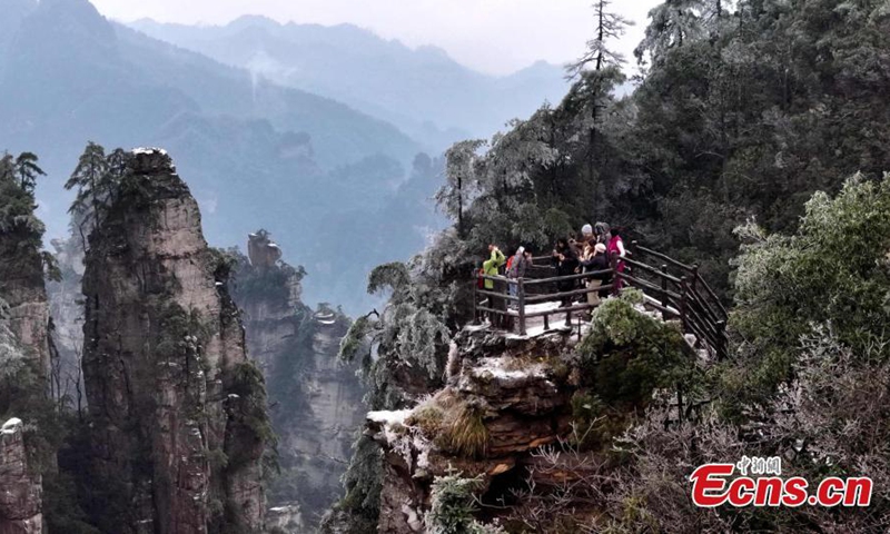 Rime-covered forest at Zhangjiajie National Forest Park, a UNESCO world heritage site, looks like an ink wash painting at Huangshi Village, central China's Hunan Province, Dec. 11, 2024. (Photo: China News Service)