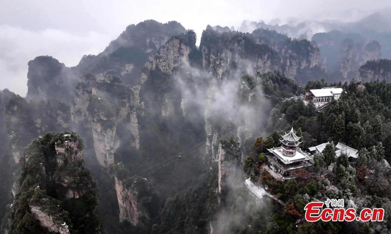 Rime-covered forest at Zhangjiajie National Forest Park, a UNESCO world heritage site, looks like an ink wash painting at Huangshi Village, central China's Hunan Province, Dec. 11, 2024. (Photo: China News Service)