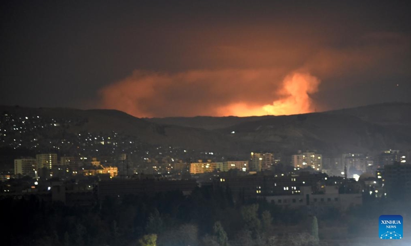 Smoke rises as a result of a series of Israeli airstrikes in Damascus, Syria, Dec. 14, 2024. Israel intensified its airstrikes against Syrian military facilities on Saturday, conducting 24 air raids in the countryside of Damascus, according to the Syrian Observatory for Human Rights. (Photo by Monsef Memari/Xinhua)