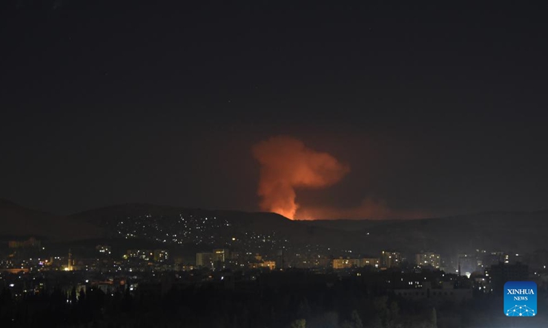 Smoke rises as a result of a series of Israeli airstrikes in Damascus, Syria, Dec. 14, 2024. Israel intensified its airstrikes against Syrian military facilities on Saturday, conducting 24 air raids in the countryside of Damascus, according to the Syrian Observatory for Human Rights. (Photo by Monsef Memari/Xinhua)