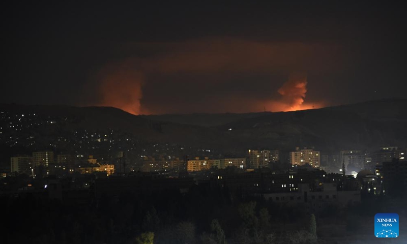 Smoke rises as a result of a series of Israeli airstrikes in Damascus, Syria, Dec. 14, 2024. Israel intensified its airstrikes against Syrian military facilities on Saturday, conducting 24 air raids in the countryside of Damascus, according to the Syrian Observatory for Human Rights. (Photo by Monsef Memari/Xinhua)