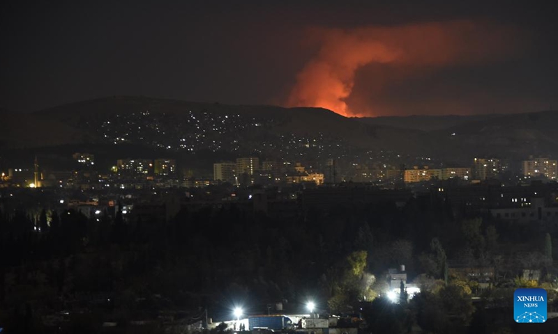 Smoke rises as a result of a series of Israeli airstrikes in Damascus, Syria, Dec. 14, 2024. Israel intensified its airstrikes against Syrian military facilities on Saturday, conducting 24 air raids in the countryside of Damascus, according to the Syrian Observatory for Human Rights. (Photo by Monsef Memari/Xinhua)