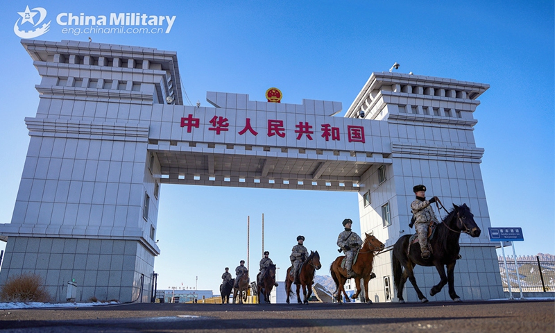 Soldiers attached to the Takixken border defense company under the Chinese PLA Xinjiang Military Command pass through theTakixken road port  during a routine patrol mission on November 29, 2024. (eng.chinamil.com.cn/Photo by Xiao Guotao)