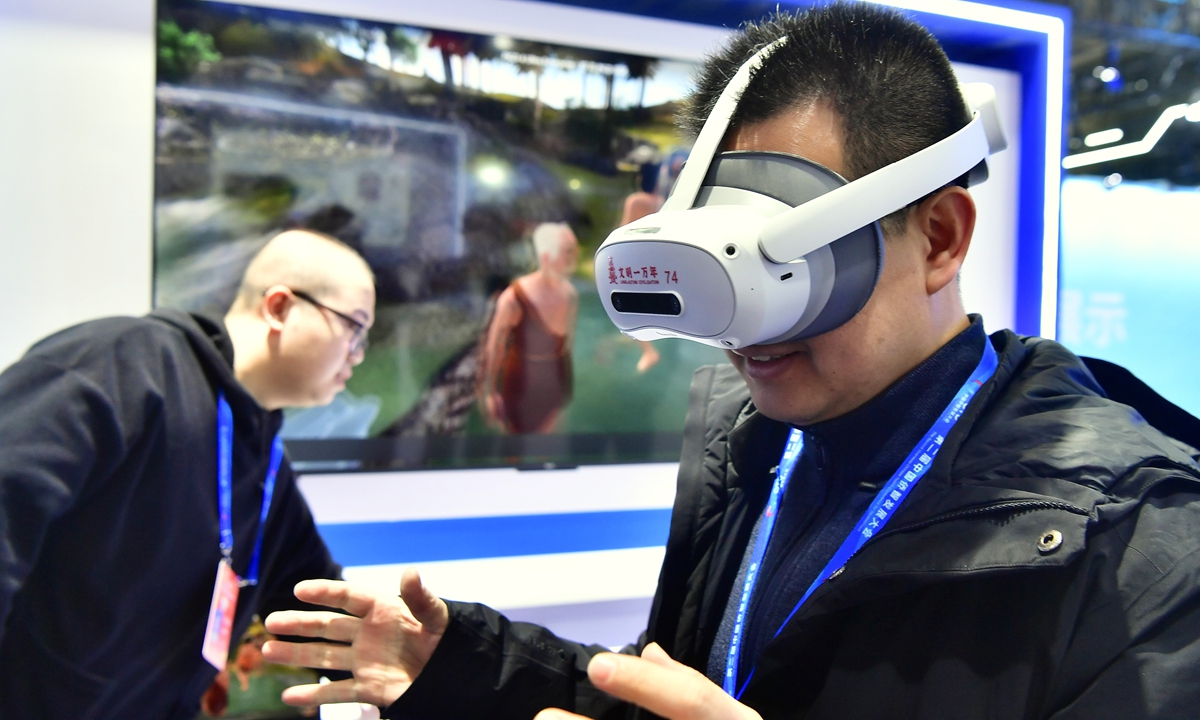 A spectator tries out a VR headset at the Second Overseas Chinese Talent Conference for Development in Fuzhou, East China's Fujian Province on December 17, 2024. China is expanding investment in the high-tech sector. From January to November, investment in high-tech industries grew by 8.8 percent year-on-year, 5.5 percentage points higher than the overall investment growth rate. Photo: VCG