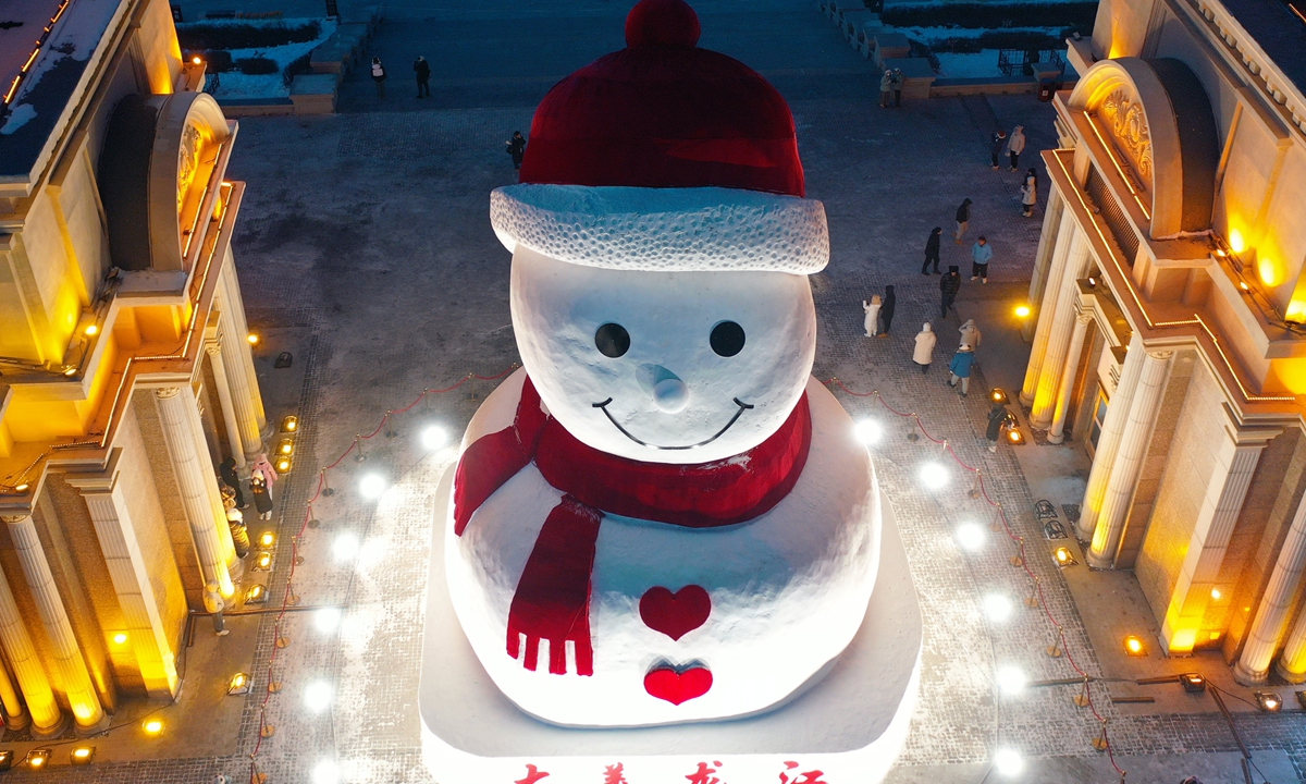 The iconic snowman sculpture at Qunli Riverside Music Plaza is completed in Harbin, Northeast China's Heilongjiang Province, on December 17, 2024, attracting many local residents and tourists to visit and take photos. Photo: VCG