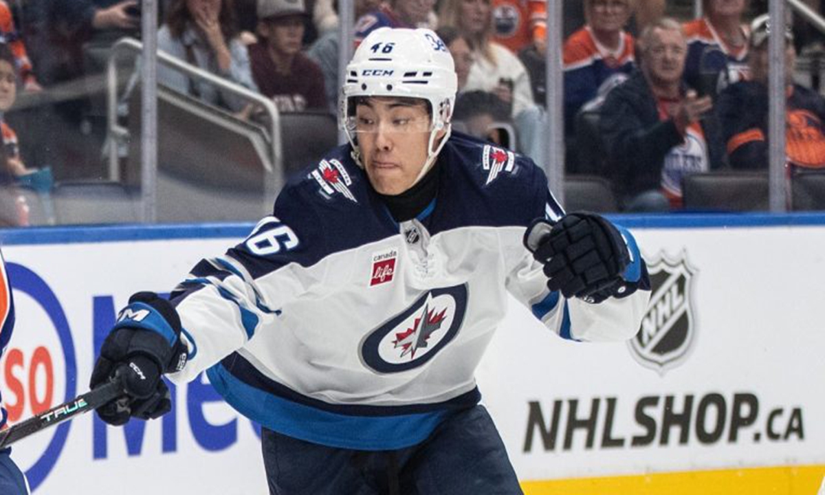 Kevin He, 18, has made history as the first Chinese-born player to sign an NHL contract. Photo: Jason Franson/CP