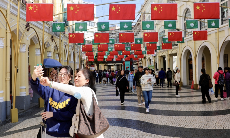 Tourists take selfies at Senado Square in South China's Macao on December 17, 2024. Photo: Lin Xiaoyi/GT