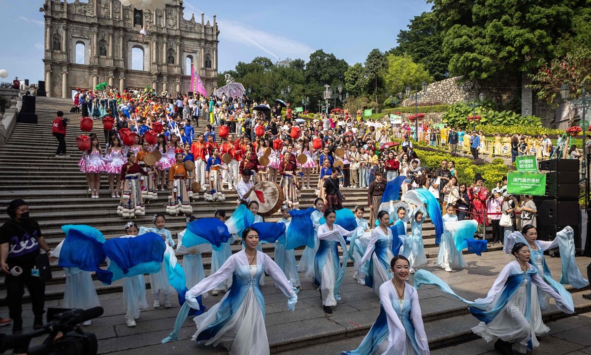 Performers dance in the Ruins of Saint Paul during the Macao International Parade in Macao on March 24, 2024. Photo: VCG