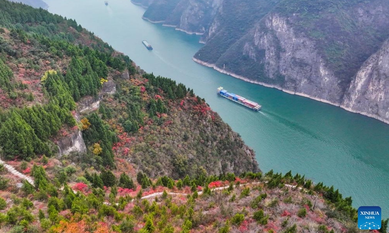 An aerial drone photo shows ships sailing in Qutang Gorge, one of the Three Gorges on the Yangtze River, in Fengjie County, southwest China's Chongqing Municipality, Dec. 19, 2024. (Xinhua/Wang Quanchao)