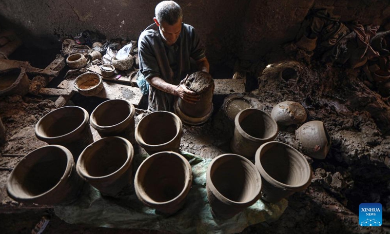 An artisan makes a pottery at a workshop at the village of Gris, Menoufia Governorate, Egypt, on Dec. 7, 2024. (Xinhua/Ahmed Gomaa)