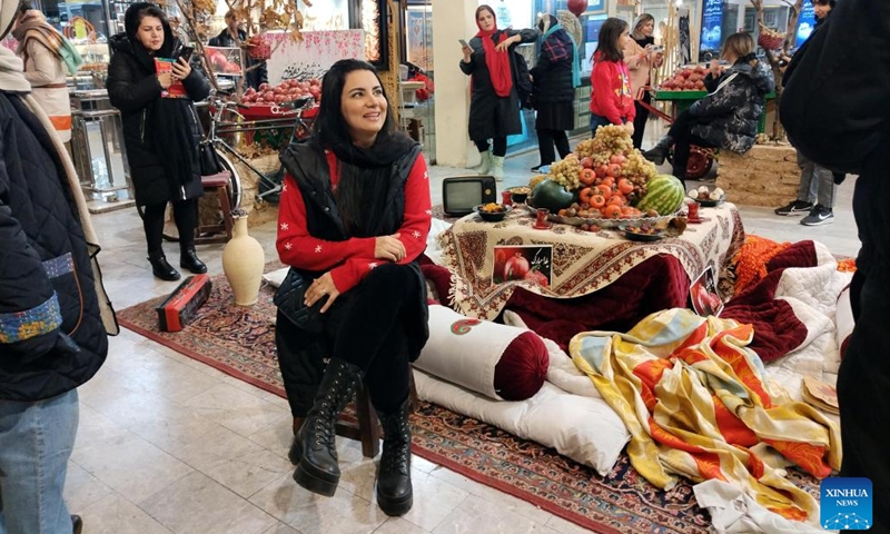 People celebrate Yalda Night at a shopping mall in Tehran, Iran, Dec. 20, 2024. Yalda Night, which is one of the oldest traditions in Iran, is to celebrate with family the longest night of the year. (Xinhua/Shadati)