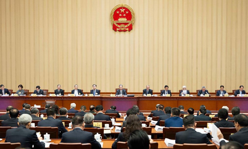 Zhao Leji, chairman of the National People's Congress (NPC) Standing Committee, presides over the first plenary meeting of the 13th session of the 14th NPC Standing Committee at the Great Hall of the People in Beijing, capital of China, Dec. 21, 2024. (Xinhua/Li Tao)