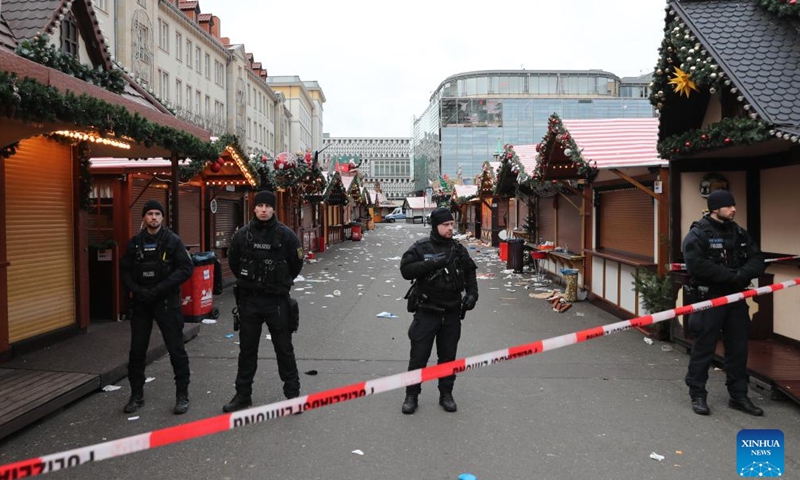 Policemen stand guard at a Christmas market where a car rammed into a crowd in Magdeburg, Germany, Dec. 21, 2024. At least five people were killed and over 200 others injured after a car rammed into a large crowd at a German Christmas market in the central German city of Magdeburg Friday evening, German news agency dpa reported Saturday, citing State Premier Reiner Haseloff.

German Chancellor Olaf Scholz expressed deep concerns over the tragic incident at the scene, saying that nearly 40 of the injured are so seriously hurt that we must be very worried about them. (Xinhua/Du Zheyu)