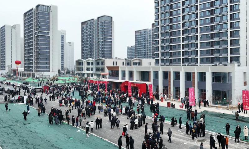 An aerial drone photo taken on Jan. 16, 2024 shows people waiting to receive the keys to their new homes at a relocation residential complex in Shijiazhuang, north China's Hebei Province. (Xinhua/Yang Shiyao)