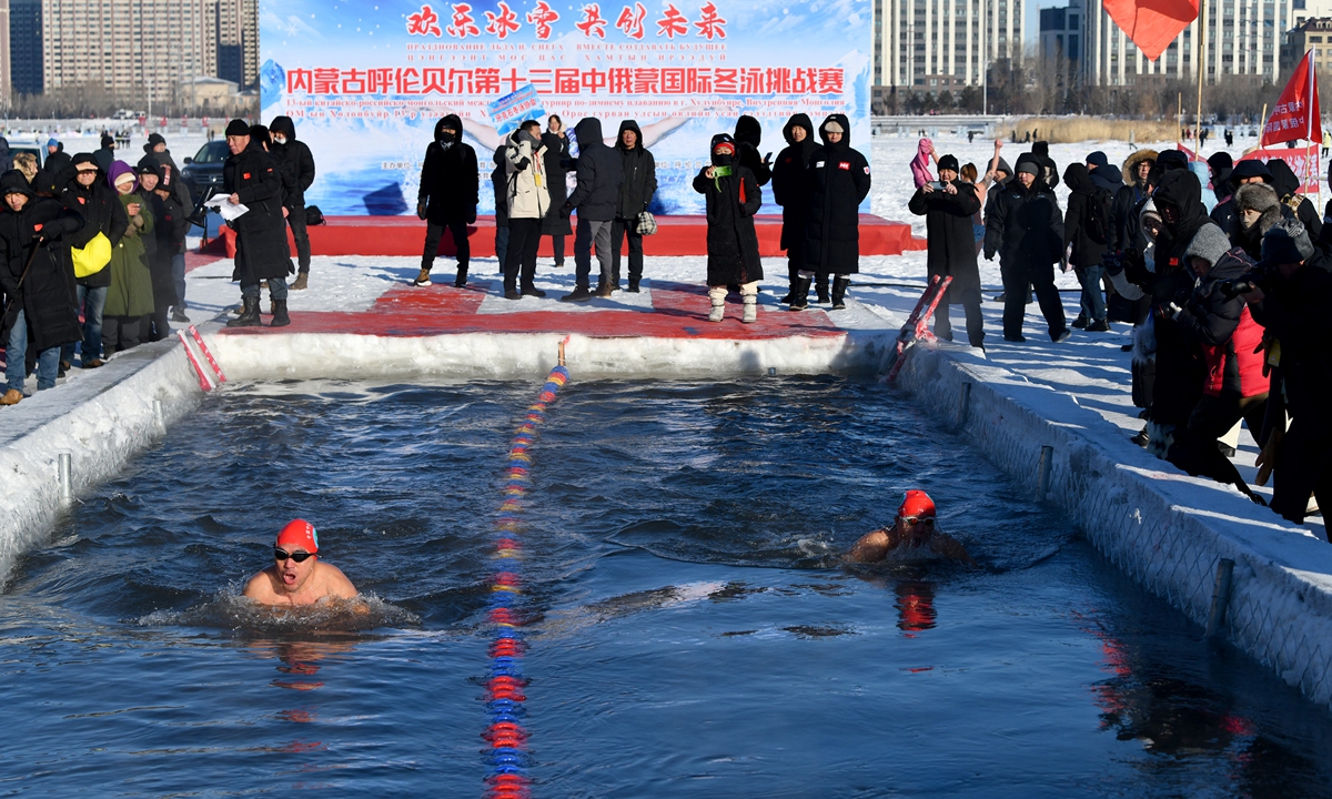 Participants compete in the China-Russia-Mongolia International Winter Swimming Competition on December 22, 2024 in Hailar, North China's Inner Mongolia Autonomous Region. The lowest temperature in Hailar reached -25 C recently. Photo: VCG