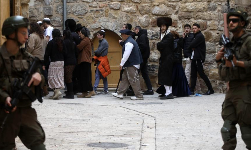 Israeli forces take security measures in the Old City of Hebron during a raid to provide protection for Jewish settlers who want to visit a historical site in Hebron, the southern West Bank, on Jan. 4, 2025. (Photo by Mamoun Wazwaz/Xinhua)