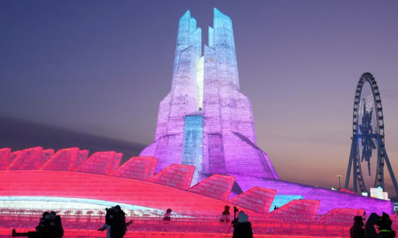 Visitors have fun at the Harbin Ice-Snow World in Harbin, northeast China's Heilongjiang Province, Jan. 5, 2025. The 41st Harbin International Ice and Snow Festival kicked off here on Sunday with the theme Dream of Winter, Love among Asia. (Xinhua/Wang Jianwei)