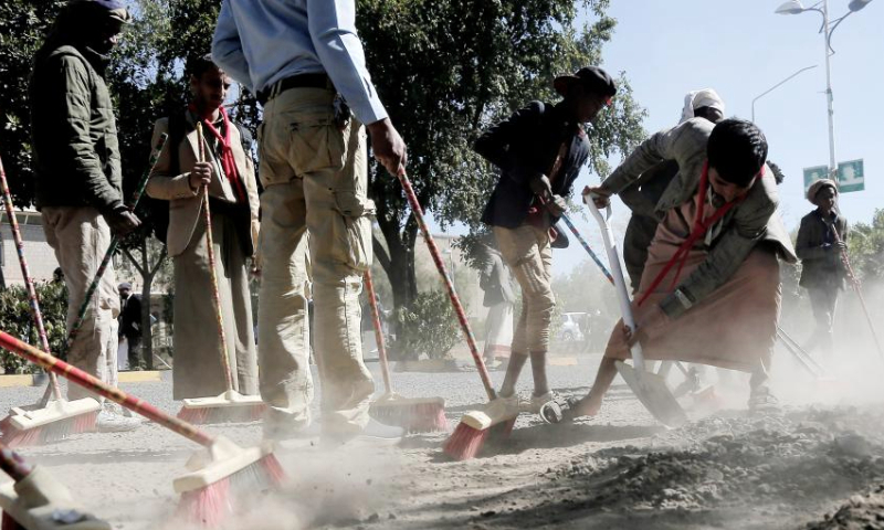 Yemeni locals participate in a comprehensive cleaning campaign launched to welcome the new year in Sanaa, Yemen, on Jan. 1, 2025. (Photo by Mohammed Mohammed/Xinhua)