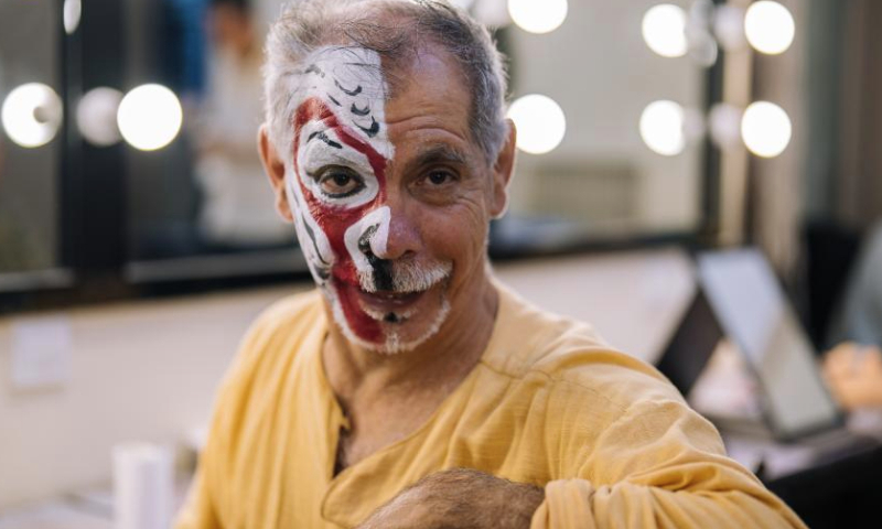 Ghaffar Pourazar poses for a photo before a Peking Opera performance in Beijing, capital of China, Sept. 30, 2024. (Xinhua/Ren Ke)