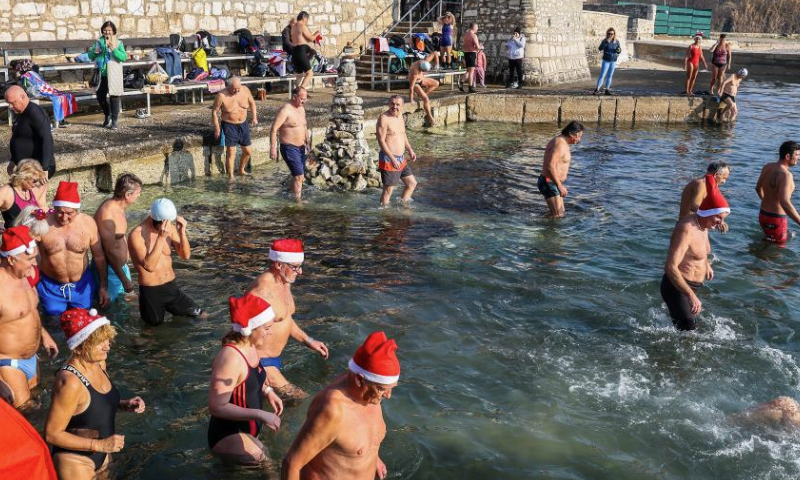 People take part in the traditional New Year's Day swimming in the sea in Pula, Croatia, on Jan. 1, 2025. (Srecko Niketic/PIXSELL via Xinhua)