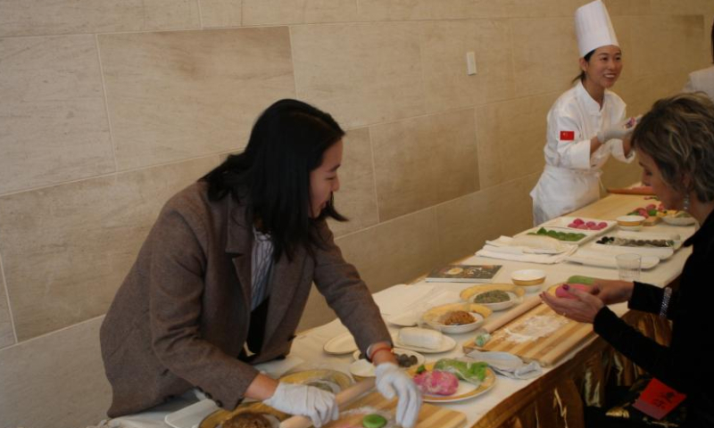 A guest participates in dumpling-making at the Chinese Embassy in the United States in Washington, D.C., on Dec. 20, 2024. The Chinese Embassy in the United States recently hosted a cultural event themed Celebrating the Winter Solstice: Sharing Warmth and Culture. Held on Dec. 20, the celebratory event was attended by more than 50 guests from various sectors of U.S. society and foreign diplomatic missions in Washington, D.C. (Xinhua/Yan Liang)