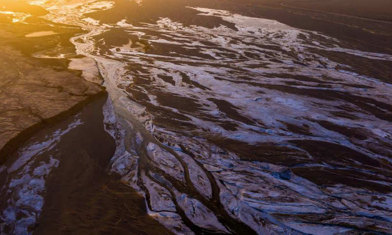 An aerial drone photo taken on Dec. 24, 2024 shows a view of the Da Haltent River in Kazak Autonomous County of Aksay, northwest China's Gansu Province. (Photo by Gao Hongshan/Xinhua)