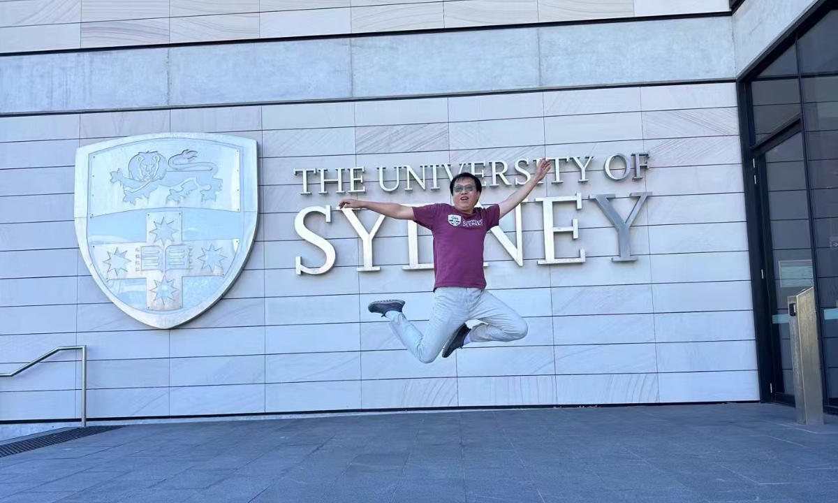 Jia Daming, 50, takes a photo at the University of Sydney. Photo: Courtesy of Jia Daming