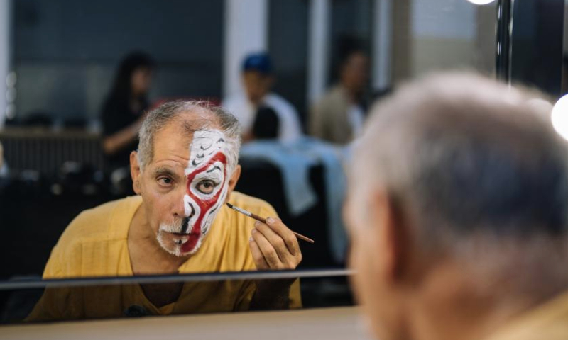 Ghaffar Pourazar makes up before a Peking Opera performance in Beijing, capital of China, Sept. 30, 2024. (Xinhua/Ren Ke)