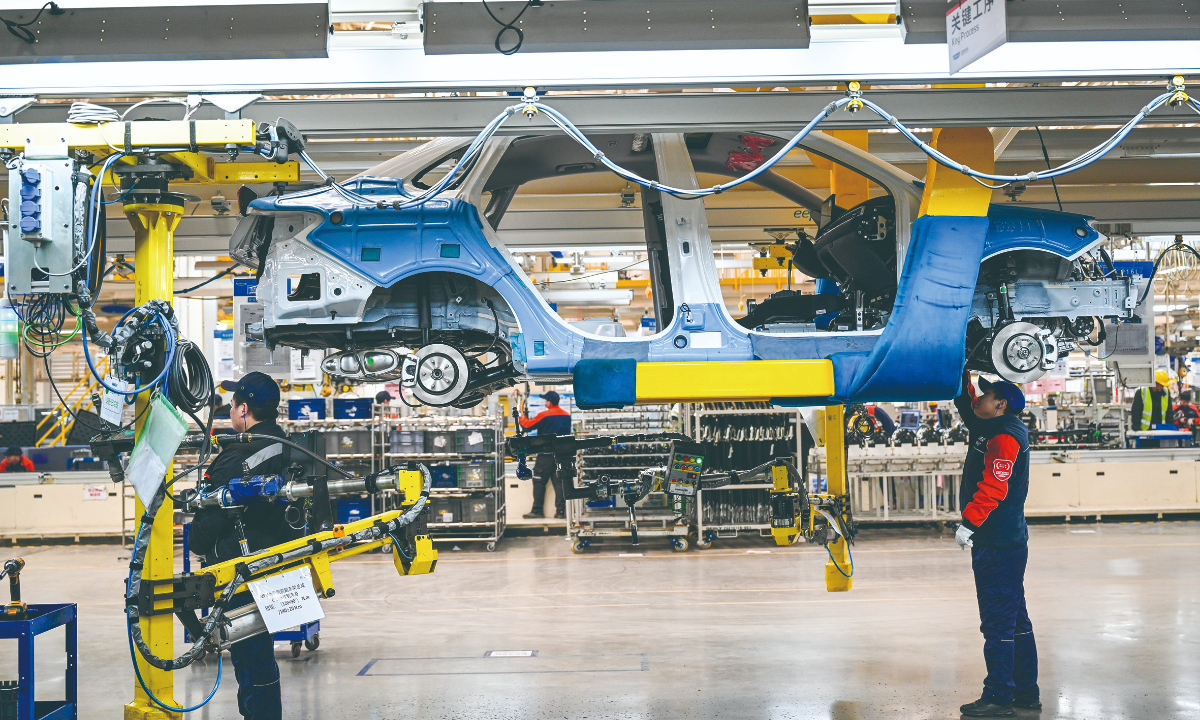 Workers operate on the digital production line at Geely Changxing New Energy Vehicle Co in Hangzhou, East China’s Zhejiang Province. Photo: VCG