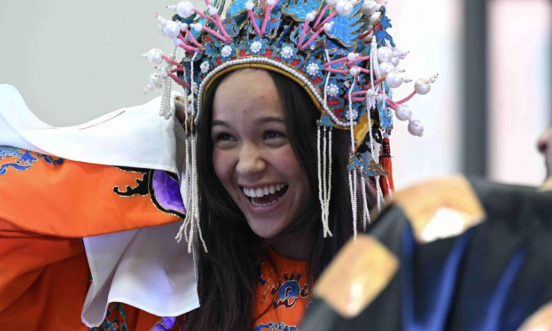 A U.S. college student tries a set of Peking Opera costumes in Shijiazhuang, north China's Hebei Province, Dec. 30, 2024. At the invitation of Shijiazhuang Foreign Language School, a group of U.S. teachers and students visit Shijiazhuang from Dec. 25 to Dec. 31. (Photo by Chen Qibao/Xinhua)