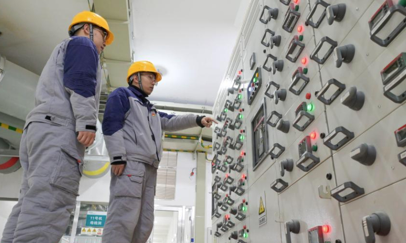 Workers patrol at the underground workshop of Fengning pumped-storage power station in Fengning Manchu Autonomous County, north China's Hebei Province, Dec. 31, 2024. Fengning power station, the pumped-storage power station with the largest installed capacity of its kind in the world, was put into full operation on Tuesday. (Photo by Wang Liqun/Xinhua)