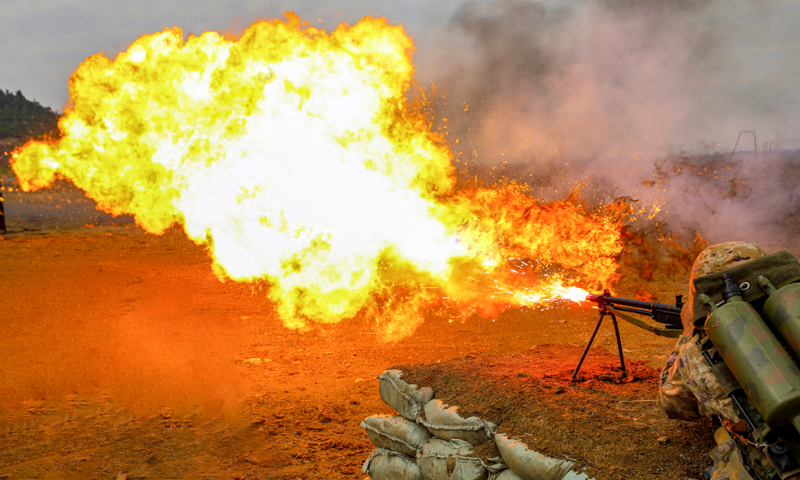 A flamethrower operator assigned to a chemical defense detachment of a brigade under the Chinese PLA Army fires at the simulated target on November 20, 2024. (eng.chinamil.com.cn/Photo by Liao Zhenxiong)