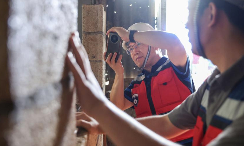 A Chinese expert takes pictures of damages inside a building in Port Vila, Vanuatu, Jan. 1, 2025.

At the request of the Vanuatu government, China has sent four experts to assist with post-earthquake response in the Pacific island country, Chinese foreign ministry spokesperson Mao Ning said Monday.

The four engineering experts from the China Earthquake Administration arrived in Port Vila, capital of Vanuatu, on Monday to carry out structural research, safety assessment and secondary disaster investigation in the hardest hit areas. (Xinhua/Long Lei)