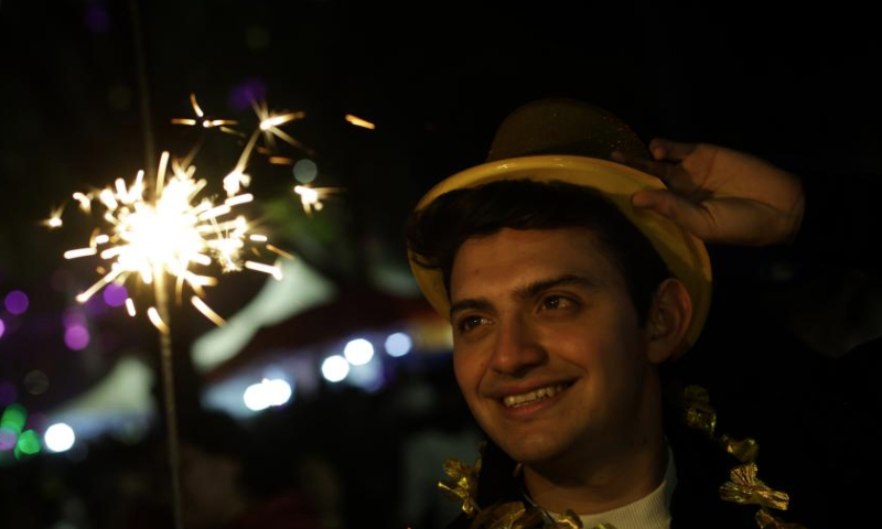 A man celebrates the new year in Mexico City, Mexico, Jan. 1, 2025. (Xinhua/Francisco Canedo)