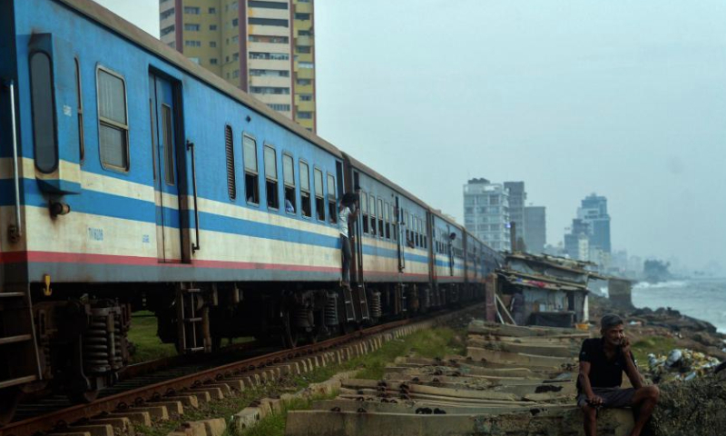 This photo taken on Dec. 18, 2024 shows a train by the sea in Colombo, Sri Lanka.

The coastal railway line, located on the west coast of Sri Lanka and close to the Indian Ocean, is a major railway line in this island country. It is also a famous tourist attraction, where the straight coastline, the carriages without doors, and the beautiful sea view throughout the journey allow people to get the unique Ceylon-style experience. (Photo by Gayan Sameera/Xinhua)