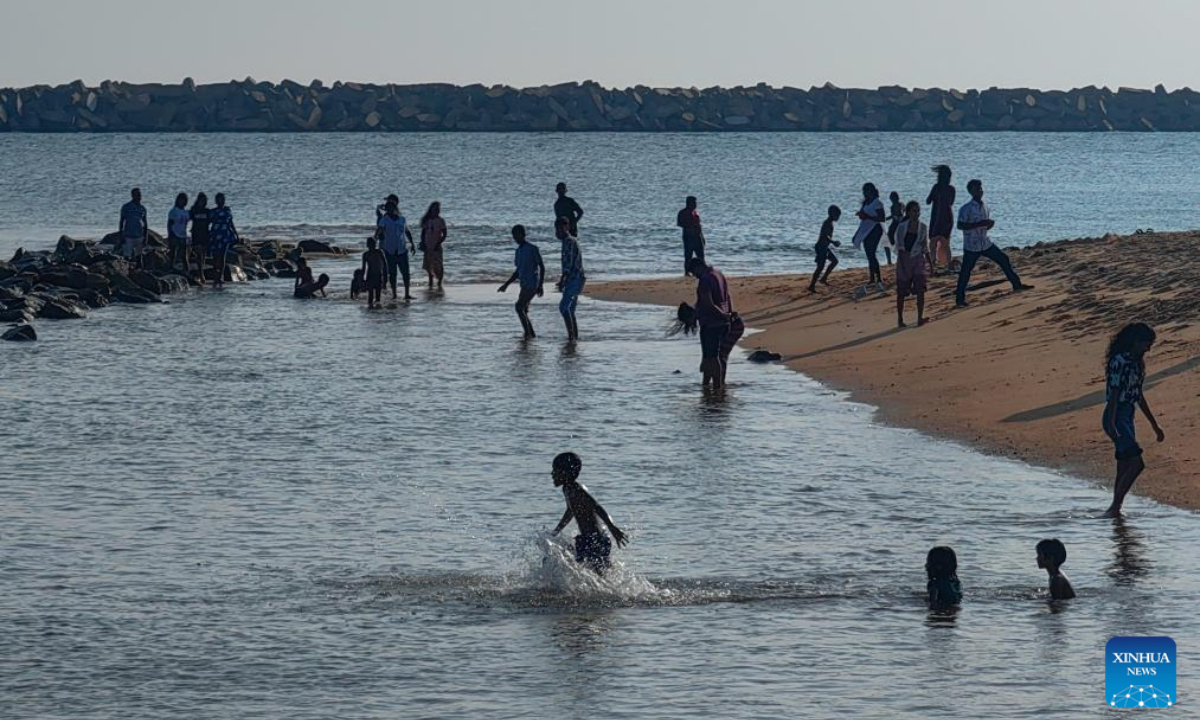 This photo taken with a mobile phone shows children playing in Colombo Port City in Colombo, Sri Lanka, Dec. 26, 2024. (Photo: Xinhua)