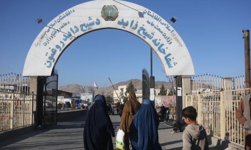 People walk at the site of an explosion in Kabul, Afghanistan, Dec. 28, 2024. At least four people sustained injuries in a blast near the Ministry of Interior in Afghanistan's capital Kabul on Saturday morning, a police officer said. The blast occurred in front of Shaikh Zayed Hospital close to the Ministry of Interior in Kabul's Police District 15, Khalid Zadran, spokesman of Kabul police chief, told Xinhua. (Photo By Saifurahman Safi/Xinhua)