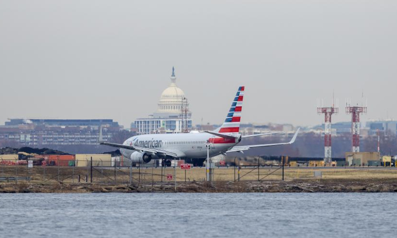 An American Airlines aircraft taxis on the runway at Ronald Reagan Washington National Airport in Arlington, Virginia, the United States, on Dec. 24, 2024. American Airlines briefly grounded flights nationwide on Tuesday due to a technical issue just as the Christmas travel season kicks into overdrive and winter weather is threatening more potential problems for those planning to fly or drive in the United States. American flights were cleared to fly by federal regulators about one hour after a national ground stop order was issued by the Federal Aviation Administration. (Xinhua/Hu Yousong)