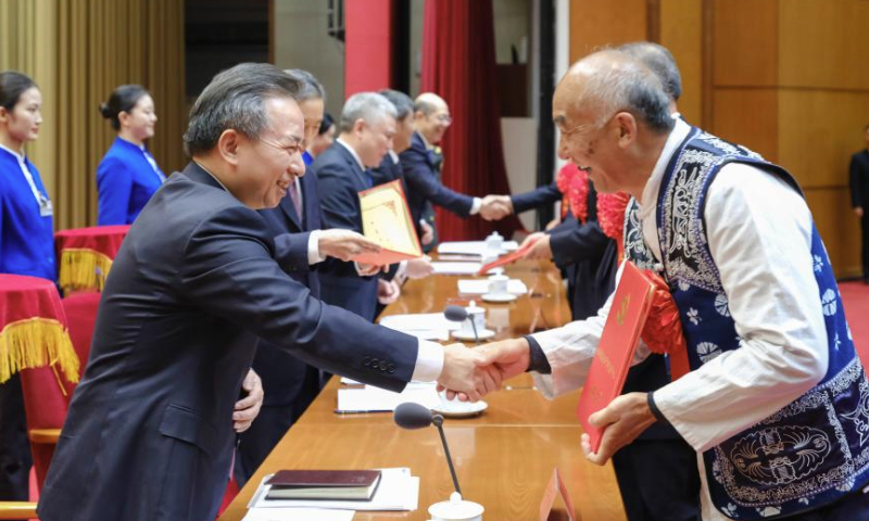 Li Ganjie, a member of the Political Bureau of the Communist Party of China (CPC) Central Committee and head of the CPC Central Committee's Organization Department, attends a ceremony to honor model retired officials and groups on Dec. 30, 2024. Li also delivered a speech at the event. (Xinhua/Ding Lin)