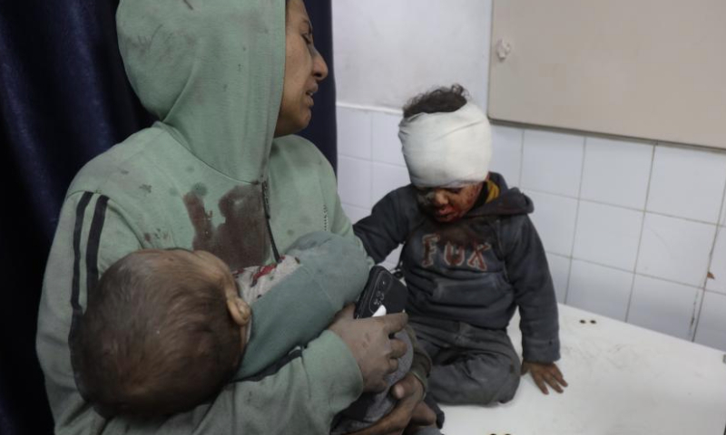 An injured child is treated at a hospital following an Israeli airstrike on the headquarters of the Civil Defense in Gaza City, on Jan. 1, 2025. The Palestinian death toll from ongoing Israeli attacks in the Gaza Strip has risen to 45,553, Gaza-based health authorities said in a statement on Wednesday. (Photo by Abdul Rahman Salama/Xinhua)