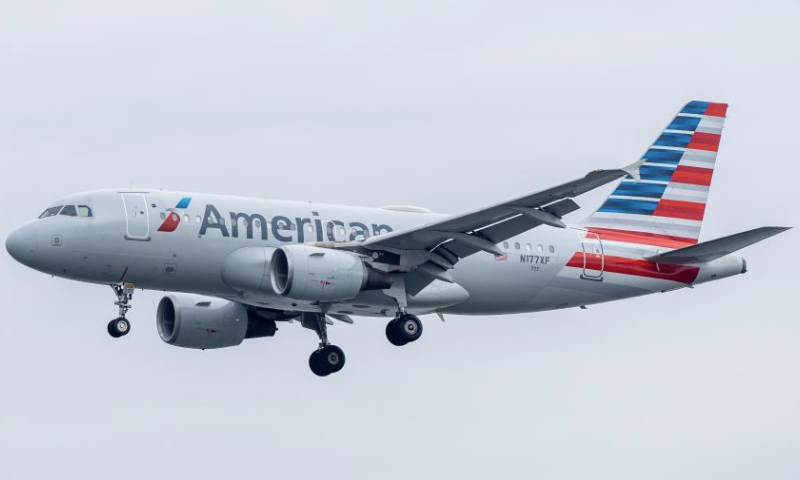 An American Airlines aircraft makes its final approach to Ronald Reagan Washington National Airport in Arlington, Virginia, the United States, on Dec. 24, 2024. American Airlines briefly grounded flights nationwide on Tuesday due to a technical issue just as the Christmas travel season kicks into overdrive and winter weather is threatening more potential problems for those planning to fly or drive in the United States. American flights were cleared to fly by federal regulators about one hour after a national ground stop order was issued by the Federal Aviation Administration. (Xinhua/Hu Yousong)