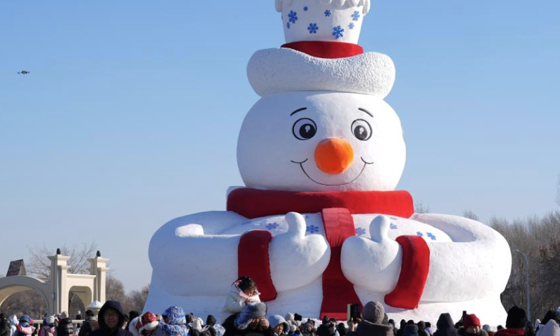 Tourists visit the 37th Sun Island International Snow Sculpture Expo in Harbin, northeast China's Heilongjiang Province, Dec. 23, 2024. The 37th Sun Island International Snow Sculpture Expo began its trial operation here Monday. (Xinhua/Wang Song)